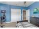 Bedroom with a twin bed, built-in closet, and workspace at 2801 Elizabeth Ave, Orlando, FL 32804