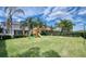 Large backyard with playset and volleyball net, perfect for  at 291 Lasso Dr, Kissimmee, FL 34747