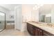 Elegant bathroom with granite countertops and a soaking tub at 291 Lasso Dr, Kissimmee, FL 34747