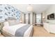 Spacious bedroom with stylish wall decor and comfortable bedding at 291 Lasso Dr, Kissimmee, FL 34747