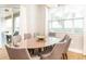 Elegant dining room with glass-top table and six chairs at 291 Lasso Dr, Kissimmee, FL 34747
