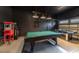 Game room with pool table, air hockey, and arcade games at 291 Lasso Dr, Kissimmee, FL 34747