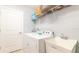 Convenient laundry room with washer, dryer, and utility sink at 291 Lasso Dr, Kissimmee, FL 34747