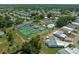 Community view, tennis courts, pool, and homes at 318 Nesbitt Park Ave, Davenport, FL 33897