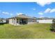 Spacious backyard with patio and grill, perfect for outdoor entertaining at 3220 Sweet Acres Pl, St Cloud, FL 34772