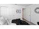 Bedroom with double doors and carpet flooring at 3220 Sweet Acres Pl, St Cloud, FL 34772