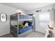 ' bedroom with gray bunk beds and nautical theme at 3220 Sweet Acres Pl, St Cloud, FL 34772