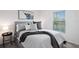 Bright bedroom with a comfortable bed and stylish decor at 3220 Sweet Acres Pl, St Cloud, FL 34772