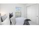 Guest bedroom with window and double doors at 3220 Sweet Acres Pl, St Cloud, FL 34772