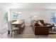 Dining area with a wooden table, six chairs, and access to the backyard at 3220 Sweet Acres Pl, St Cloud, FL 34772