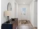 Bright entryway with a stylish console table and rug at 3220 Sweet Acres Pl, St Cloud, FL 34772