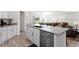 Open concept kitchen with island and stainless steel appliances at 3220 Sweet Acres Pl, St Cloud, FL 34772