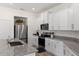 Modern kitchen with stainless steel appliances and granite countertops at 3220 Sweet Acres Pl, St Cloud, FL 34772