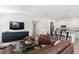 Spacious living room with leather furniture and a large TV at 3220 Sweet Acres Pl, St Cloud, FL 34772