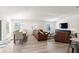 Open concept living room and dining area with hardwood floors at 3220 Sweet Acres Pl, St Cloud, FL 34772