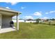 Covered patio with grill, providing a shaded outdoor space at 3220 Sweet Acres Pl, St Cloud, FL 34772