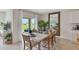 Dining area with large mirror and patio access at 33487 Tacking Way, Sorrento, FL 32776