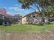 Landscaped backyard with large tree and pool access at 349 New Waterford Pl, Longwood, FL 32779