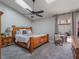 Spacious Primary bedroom with wood bed frame and access to backyard at 349 New Waterford Pl, Longwood, FL 32779