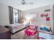 Cozy bedroom with plush carpet, ample natural light, and playful decor at 349 New Waterford Pl, Longwood, FL 32779