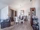 Formal dining room with a large table and hardwood floors at 349 New Waterford Pl, Longwood, FL 32779