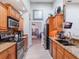 Modern kitchen with stainless steel appliances and granite countertops at 349 New Waterford Pl, Longwood, FL 32779