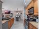 Open concept kitchen with granite countertops and stainless steel appliances at 349 New Waterford Pl, Longwood, FL 32779