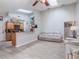 Open kitchen with a breakfast bar, wood cabinets, and granite countertops at 349 New Waterford Pl, Longwood, FL 32779