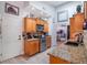 Well-equipped kitchen boasting granite countertops, stainless steel appliances, and ample cabinetry at 349 New Waterford Pl, Longwood, FL 32779
