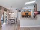 Spacious kitchen with an island, wood cabinets, granite countertops, and stainless steel appliances at 349 New Waterford Pl, Longwood, FL 32779