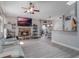 Living room with stone fireplace, built-in shelving, and hardwood floors at 349 New Waterford Pl, Longwood, FL 32779