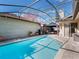Large swimming pool with screened enclosure and patio furniture at 349 New Waterford Pl, Longwood, FL 32779