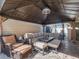 Relaxing poolside patio with covered seating area at 349 New Waterford Pl, Longwood, FL 32779