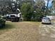 House exterior with yard and parked cars at 3614 Grice St, Apopka, FL 32703