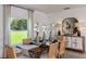Elegant dining room with wooden table and stylish decor at 4765 Cloister St, Kissimmee, FL 34758
