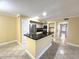 Kitchen with stainless steel appliances and breakfast bar at 498 N Pin Oak Pl # 104, Longwood, FL 32779