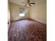 Bedroom featuring a ceiling fan and a window at 511 Coventry Ct, Mount Dora, FL 32757