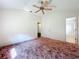 Spacious bedroom with neutral walls and a ceiling fan at 511 Coventry Ct, Mount Dora, FL 32757