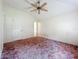 Bedroom features ample space and a ceiling fan for comfortable living and a blank canvas for personalization at 511 Coventry Ct, Mount Dora, FL 32757