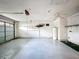 Spacious garage with ample storage, a ceiling fan and an automatic door opener at 511 Coventry Ct, Mount Dora, FL 32757