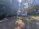 Private backyard with shed surrounded by trees at 520 N Orange, Orange City, FL 32763