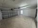 Spacious garage with overhead door and ample storage space at 520 N Orange, Orange City, FL 32763