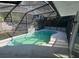 Inviting kidney-shaped pool with screened enclosure at 520 N Orange, Orange City, FL 32763