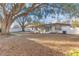 Spacious backyard offering shade under large oak trees at 5300 Lido St, Orlando, FL 32807
