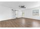 Bright bedroom featuring hardwood floors, recessed lighting, a ceiling fan, and sliding barn door at 5300 Lido St, Orlando, FL 32807