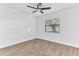 Well-lit bedroom with ceiling fan and wood-look floors at 5300 Lido St, Orlando, FL 32807