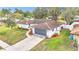 Aerial view of home showing professional landscaping, brick accents, and a two-car garage at 5300 Lido St, Orlando, FL 32807