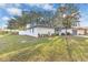 A beautiful single-story home with well-manicured lawn and white perimeter fence at 5300 Lido St, Orlando, FL 32807