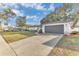 Charming single-story home with a well-maintained front lawn and a two-car garage at 5300 Lido St, Orlando, FL 32807