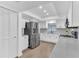 Bright kitchen with stainless steel appliances, modern white cabinetry, and ample counter space, perfect for cooking and entertaining at 5300 Lido St, Orlando, FL 32807